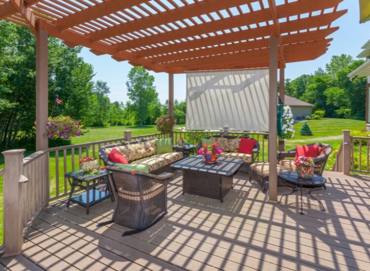 Inviting backyard patio deck with a pergola by Pergola Cincinnati.